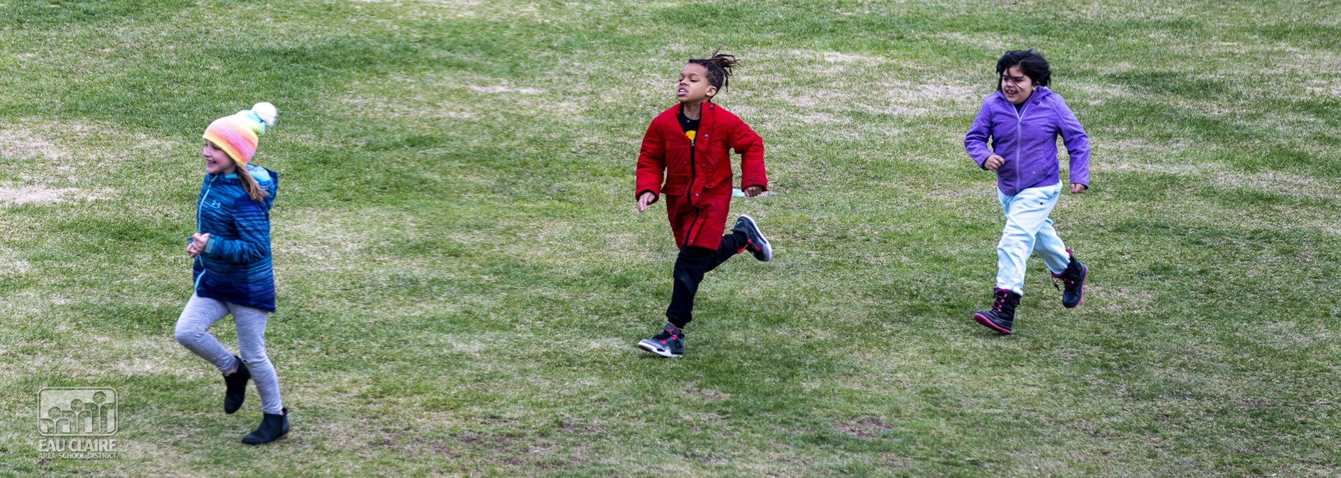 students running on grass